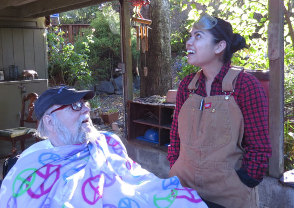 ElderFriends Jack Slack and Laura Heng talk about a blacksmith lesson.