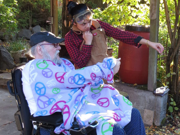 An Elder and his Friend discuss a project during an ElderFriend visit.