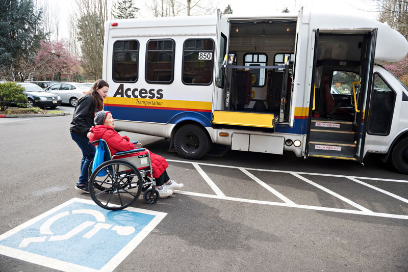 Resident in a wheelchair getting ready to load onto an Access bus.